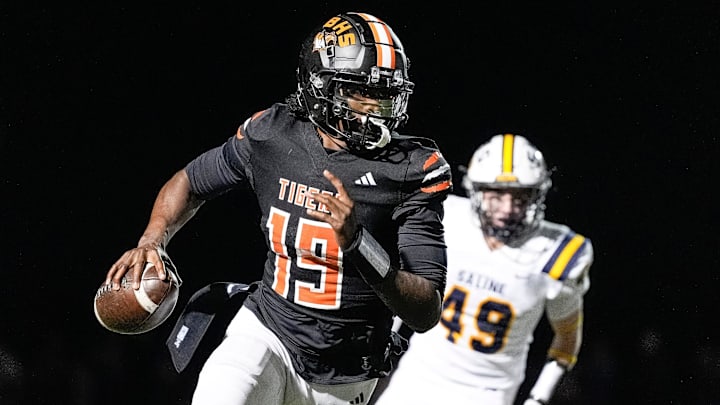 Belleville quarterback Bryce Underwood keeps the ball and runs against Saline during the second half of district final at Belleville High School in Belleville on Friday, Nov. 8, 2024. Belleville quarterback Bryce Underwood keeps the ball and runs against Saline during the second half of district final at Belleville High School in Belleville on Friday, Nov. 8, 2024.