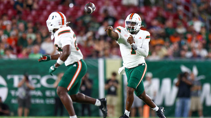 Sep 21, 2024; Tampa, Florida, USA; Miami Hurricanes quarterback Cam Ward (1) throws a pass against the South Florida Bulls in the third quarter at Raymond James Stadium. Mandatory Credit: Nathan Ray Seebeck-Imagn Images Sep 21, 2024; Tampa, Florida, USA; Miami Hurricanes quarterback Cam Ward (1) throws a pass against the South Florida Bulls in the third quarter at Raymond James Stadium. Mandatory Credit: Nathan Ray Seebeck-Imagn Images