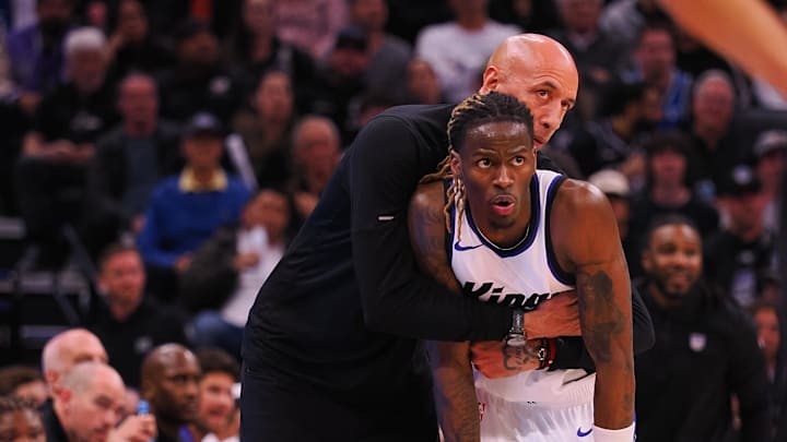 Mar 19, 2025; Sacramento, California, USA; Sacramento Kings interim head coach Doug Christie embraces guard Keon Ellis (23) between plays against the Cleveland Cavaliers during the fourth quarter at Golden 1 Center. Mandatory Credit: Kelley L Cox-Imagn Images