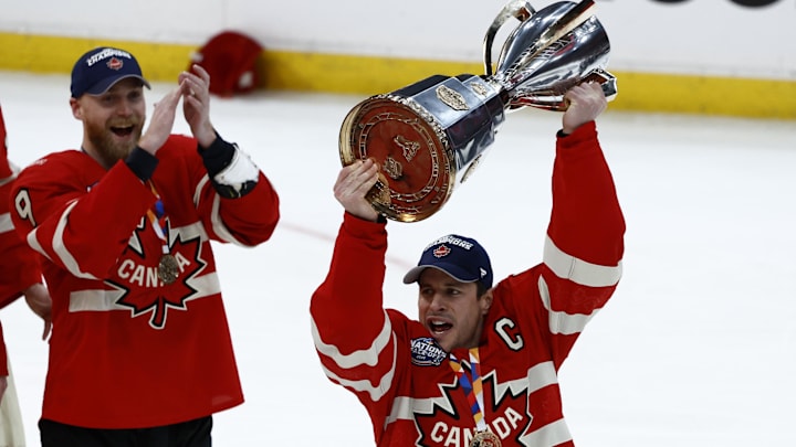 Team Canada forward Sidney Crosby lifts the 4 Nations Face-Off trophy after winning against Team USA in overtime. Team Canada forward Sidney Crosby lifts the 4 Nations Face-Off trophy after winning against Team USA in overtime.