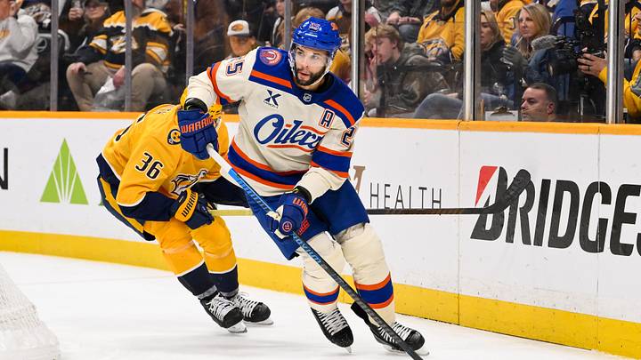 Jan 13, 2026; Nashville, Tennessee, USA;  Edmonton Oilers defenseman Darnell Nurse (25) skates behind the net against the Nashville Predators during the third period at Bridgestone Arena. Mandatory Credit: Steve Roberts-Imagn Images