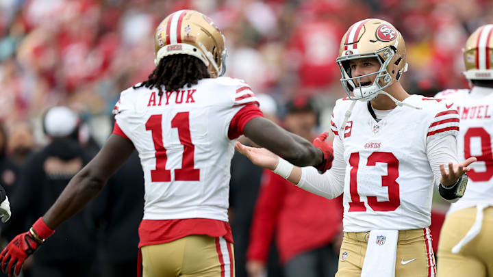 San Francisco 49ers wide receiver Brandon Aiyuk (L) and quarterback Brock Purdy (R)