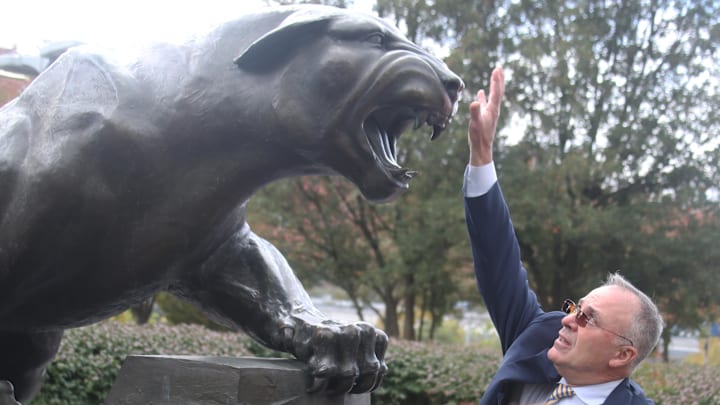 Oct 25, 2025; Pittsburgh, Pennsylvania, USA;  Pittsburgh Panthers head coach Pat Narduzzi touches the Panther statue for luck before entering  Acrisure Stadium to play the North Carolina State Wolfpack. Mandatory Credit: Charles LeClaire-Imagn Images