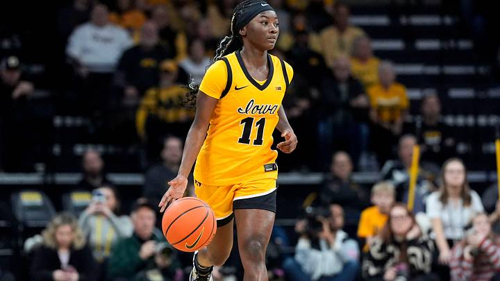 Iowa guard Chit-Chat Wright (11) brings the ball up the court against the Ohio State Buckeyes Jan. 25, 2026 at Carver-Hawkeye Arena in Iowa City, Iowa. Iowa guard Chit-Chat Wright (11) brings the ball up the court against the Ohio State Buckeyes Jan. 25, 2026 at Carver-Hawkeye Arena in Iowa City, Iowa.