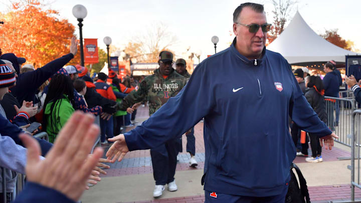 Nov 2, 2024; Champaign, Illinois, USA;  Illinois Fighting Illini head coach Bret Bielema gets a hand from the crowd before the start of a game with the Minnesota Golden Gophers at Memorial Stadium. Mandatory Credit: Ron Johnson-Imagn Images