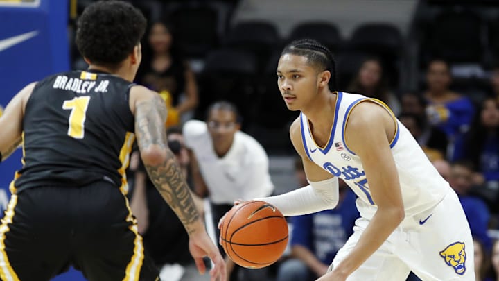 Nov 18, 2024; Pittsburgh, Pennsylvania, USA;  Pittsburgh Panthers guard Jaland Lowe (15) brings the ball up court against Virginia Military Keydets guard Rickey Bradley Jr. (1) during the first half at the Petersen Events Center. Mandatory Credit: Charles LeClaire-Imagn Images