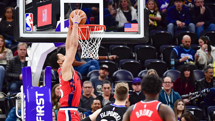 Feb 13, 2025; Salt Lake City, Utah, USA; LA Clippers guard/forward Ben Simmons (25) dunks over Utah Jazz center Kyle Filipowski (22) during the first half at the Delta Center. Mandatory Credit: Christopher Creveling-Imagn Images