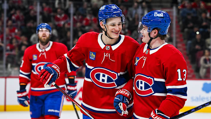 Apr 14, 2025; Montreal, Quebec, CAN; Montreal Canadiens right wing Ivan Demidov (93) celebrates with right wing Cole Caufield (13) after his first career goal against the Chicago Blackhawks in the first period at Bell Centre. Mandatory Credit: David Kirouac-Imagn Images