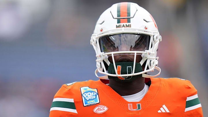 Dec 28, 2024; Orlando, FL, USA; Miami Hurricanes quarterback Cam Ward (1) warms up prior to the game against the Iowa State Cyclones at Camping World Stadium. Mandatory Credit: Jasen Vinlove-Imagn Images