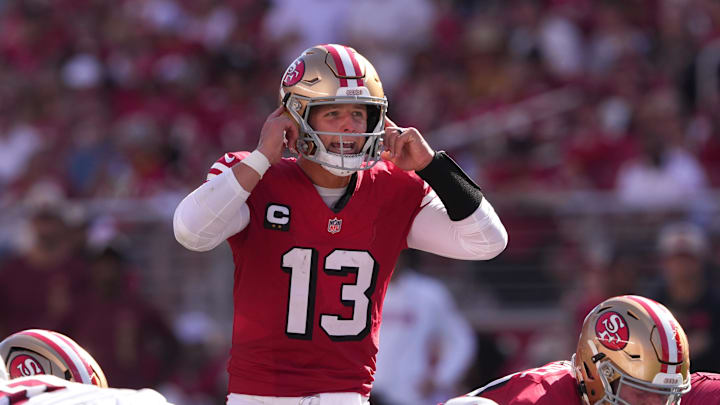 Oct 6, 2024; Santa Clara, California, USA; San Francisco 49ers quarterback Brock Purdy (13) yells during the third quarter against the Arizona Cardinals at Levi's Stadium. Mandatory Credit: Darren Yamashita-Imagn Images