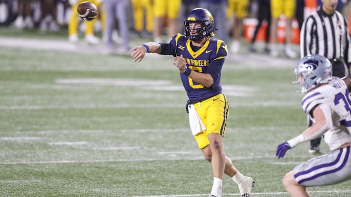 Oct 19, 2024; Morgantown, West Virginia, USA; West Virginia Mountaineers quarterback Garrett Greene (6) throws during the second quarter against the Kansas State Wildcats at Mountaineer Field at Milan Puskar Stadium. Mandatory Credit: Ben Queen-Imagn Images