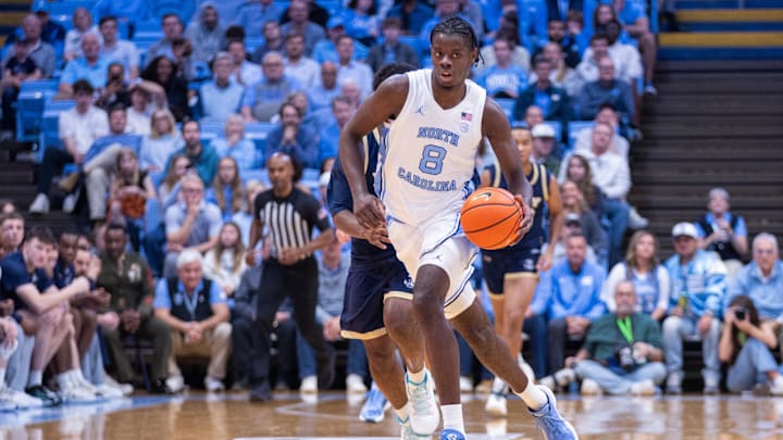 Nov 18, 2025; Chapel Hill, North Carolina, USA; North Carolina Tar Heels forward Caleb Wilson (8) brings the ball up court against the Navy Midshipmen during the second half at Dean E. Smith Center. Mandatory Credit: Scott Kinser-Imagn Images