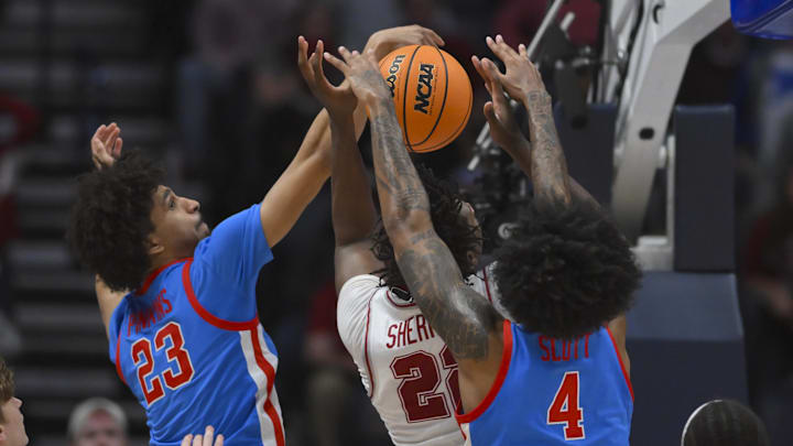Mar 13, 2026; Nashville, TN, USA;  Mississippi Rebels forward James Scott (4) and guard Patton Pinkins (23) blocks the shot of Alabama Crimson Tide forward Aiden Sherrell (22) during the second half at Bridgestone Arena. Mandatory Credit: Steve Roberts-Imagn Images