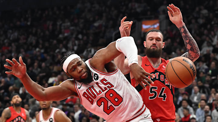 Feb 5, 2026; Toronto, Ontario, CAN;  Chicago Bulls forward Guerschon Yabusele (28) battles for a rebound with Toronto Raptors center Sandro Mamukelashvili (54) in the first half at Scotiabank Arena. Mandatory Credit: Dan Hamilton-Imagn Images