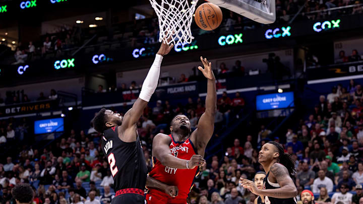 Mar 16, 2024; New Orleans, Louisiana, USA;  New Orleans Pelicans forward Zion Williamson (1) drives to the basket against Portland Trail Blazers center Deandre Ayton (2) during the second half at Smoothie King Center. Mandatory Credit: Stephen Lew-Imagn Images