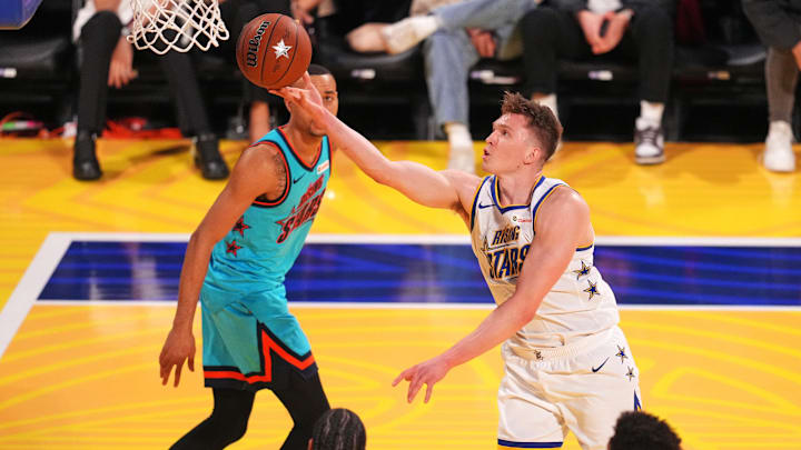 Feb 14, 2025; San Francisco, California, USA; Team C forward Dalton Knecht (4) of the Los Angeles Lakers controls the ball during the 2025 NBA Rising Stars Game at Chase Center. Mandatory Credit: Cary Edmondson-Imagn Images