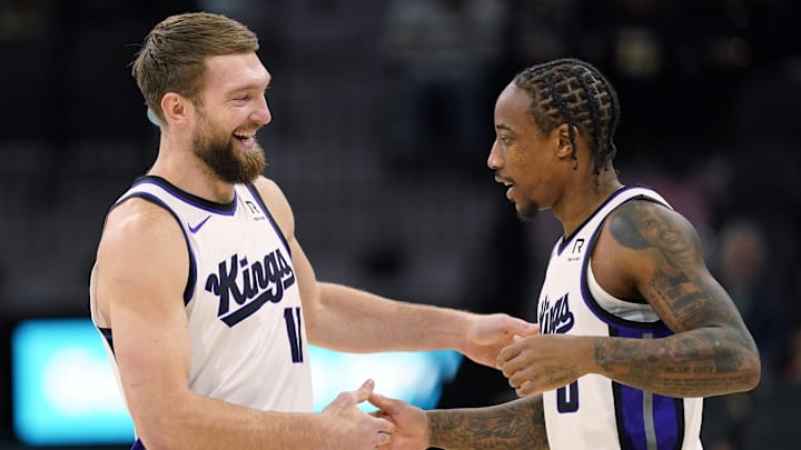 Dec 6, 2024; San Antonio, Texas, USA; Sacramento Kings center Domantas Sabonis (11) and forward DeMar DeRozan (10) embrace before a game the San Antonio Spurs at Frost Bank Center. Mandatory Credit: Scott Wachter-Imagn Images