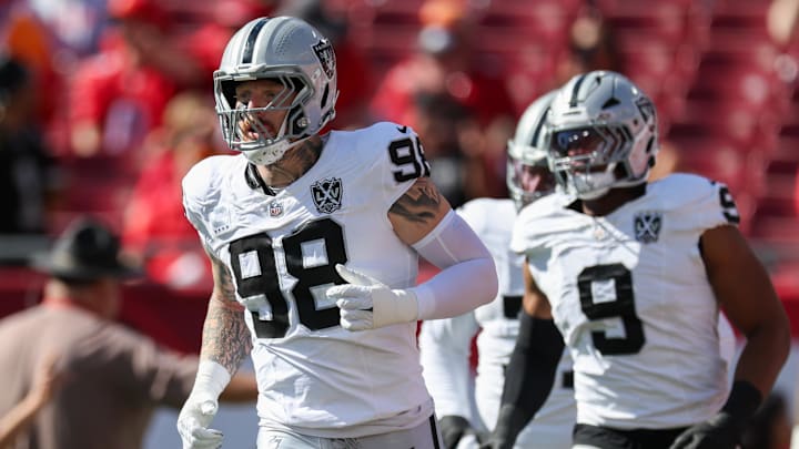Dec 8, 2024; Tampa, Florida, USA; Las Vegas Raiders defensive end Maxx Crosby (98) takes the field for a game against the Tampa Bay Buccaneers at Raymond James Stadium. Mandatory Credit: Nathan Ray Seebeck-Imagn Images