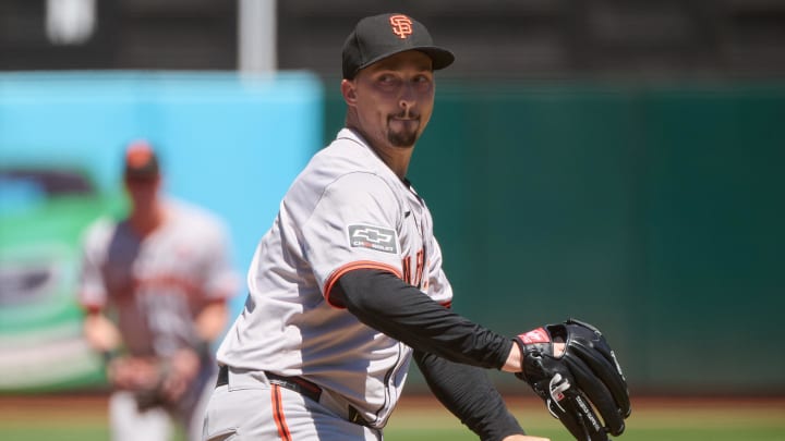 Aug 18, 2024; Oakland, California, USA; San Francisco Giants starting pitcher Blake Snell (7) prepares to throw a pitch against the Oakland Athletics during the first inning at Oakland-Alameda County Coliseum.