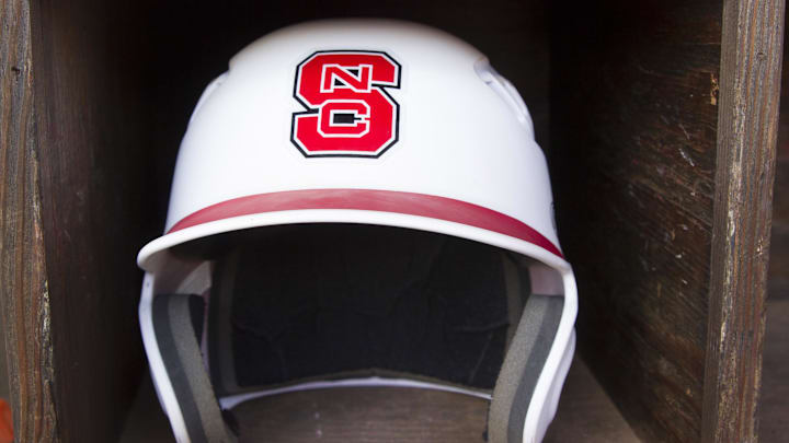 Jun 8, 2013; Raleigh, NC, USA; A North Carolina State Wolfpack helmet lies in the dugout before the game against the Rice Owls in the Raleigh super regional of the 2013 NCAA baseball tournament at Doak Field. Mandatory Credit: Jeremy Brevard-Imagn Images