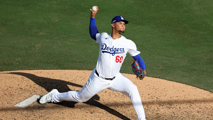 Oct 14, 2024; Los Angeles, California, USA;Los Angeles Dodgers pitcher Edgardo Henriquez (60) throws a pitch against the New York Mets in the seventh inning during game two of the NLCS for the 2024 MLB Playoffs at Dodger Stadium. Mandatory Credit: Kiyoshi Mio-Imagn Images
