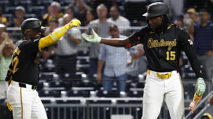 Pittsburgh Pirates designated hitter Andrew McCutchen (22) celebrates his three-run home run with center fielder Oneil Cruz (15) against the Miami Marlins during the fifth inning at PNC Park. 