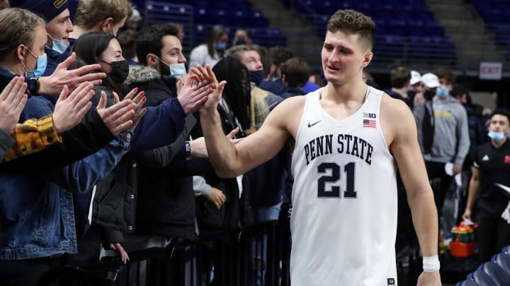 Penn State men's basketball player John Harrar greets fans after a Nittany Lions victory at the Bryce Jordan Center. 