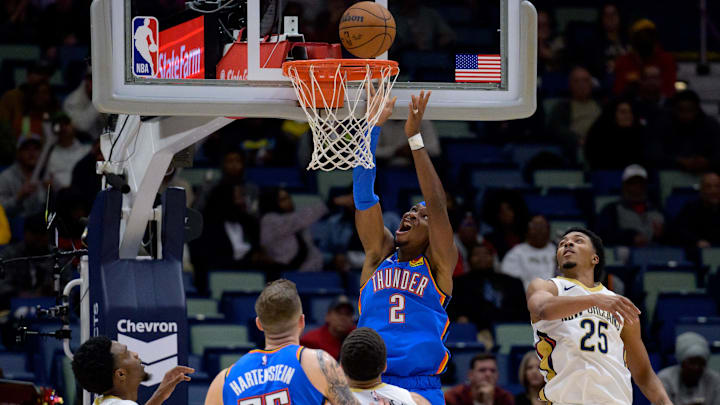 Dec 7, 2024; New Orleans, Louisiana, USA; Oklahoma City Thunder guard Shai Gilgeous-Alexander (2) shoots against New Orleans Pelicans guard Trey Murphy III (25) during the second half at Smoothie King Center. Mandatory Credit: Matthew Hinton-Imagn Images Dec 7, 2024; New Orleans, Louisiana, USA; Oklahoma City Thunder guard Shai Gilgeous-Alexander (2) shoots against New Orleans Pelicans guard Trey Murphy III (25) during the second half at Smoothie King Center. Mandatory Credit: Matthew Hinton-Imagn Images