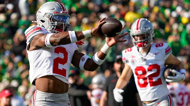 Ohio State Buckeyes safety Caleb Downs (2) catches a ball during warm ups prior to the College Football Playoff quarterfinal against the Oregon Ducks at the Rose Bowl in Pasadena, Calif. on Jan. 1, 2025.