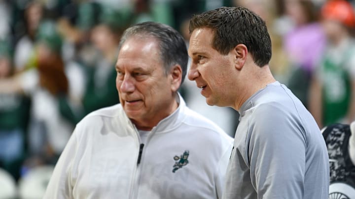 Former Michigan State player Mat Ishbia, right, talks with head coach Tom Izzo before the game against Maryland on Saturday, Feb. 3, 2024, at the Breslin Center in East Lansing.