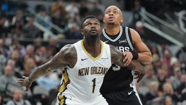 Jan 25, 2026; San Antonio, Texas, USA;  New Orleans Pelicans forward Zion Williamson (1) and San Antonio Spurs forward Keldon Johnson (3) looks up for a rebound in the first at Frost Bank Center. 
