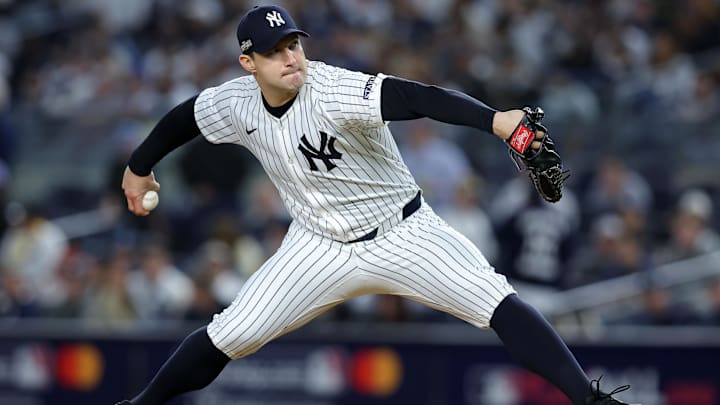 Oct 7, 2024; Bronx, New York, USA; New York Yankees pitcher Tommy Kahnle (41) throws a pitch against the Kansas City Royals in the eighth inning during game two of the ALDS for the 2024 MLB Playoffs at Yankee Stadium. Mandatory Credit: Brad Penner-Imagn Images