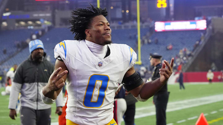 Dec 28, 2024; Foxborough, Massachusetts, USA; Los Angeles Chargers linebacker Daiyan Henley (0) celebrates after defeating the New England Patriots at Gillette Stadium. Mandatory Credit: Gregory Fisher-Imagn Images