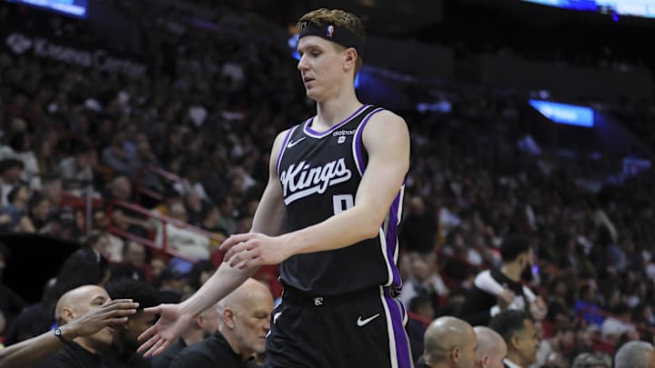 Jan 31, 2024; Miami, Florida, USA; Sacramento Kings guard Kevin Huerter (9) high-fives his teammates against the Miami Heat during the third quarter at Kaseya Center. Mandatory Credit: Sam Navarro-Imagn Images