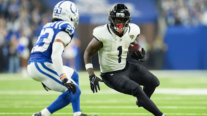 Indianapolis Colts cornerback Kenny Moore II (23) looks to bring down Jacksonville Jaguars running back Travis Etienne Jr. (1) on Sunday, Dec. 28, 2025, during a game at Lucas Oil Stadium in Indianapolis.