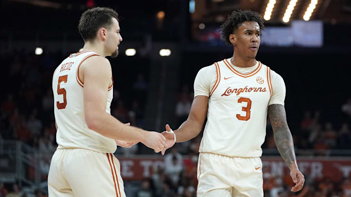 Texas Longhorns guard Dailyn Swain is congratulated by forward Camden Heide during the first half at Moody Center.
