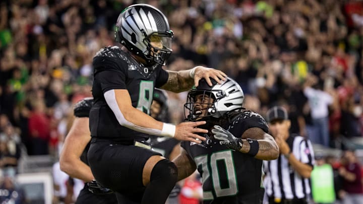 Oregon Ducks quarterback Dillon Gabriel and Oregon Ducks running back Jordan James celebrate a touchdown by Gabriel as the No. 3 Oregon Ducks host the No. 2 Ohio State Buckeyes Saturday, Oct. 12, 2024 at Autzen Stadium in Eugene, Ore.