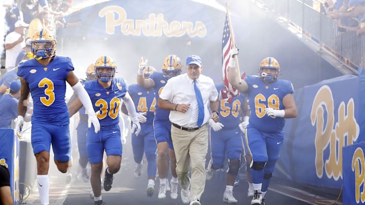 Sep 21, 2024; Pittsburgh, Pennsylvania, USA; Pittsburgh Panthers defensive back Donovan McMillon (3) and linebacker Brandon George (30) and head coach Pat Narduzzi (tie) and offensive lineman Matt Metrosky (69) take the field to play the Youngstown State Penguins against at Acrisure Stadium. Mandatory Credit: Charles LeClaire-Imagn Images Sep 21, 2024; Pittsburgh, Pennsylvania, USA; Pittsburgh Panthers defensive back Donovan McMillon (3) and linebacker Brandon George (30) and head coach Pat Narduzzi (tie) and offensive lineman Matt Metrosky (69) take the field to play the Youngstown State Penguins against at Acrisure Stadium. Mandatory Credit: Charles LeClaire-Imagn Images