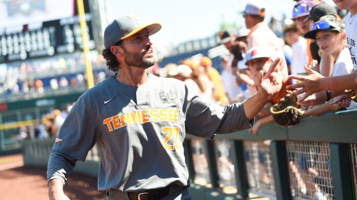Tennessee head coach Tony Vitello high fives fans afterthe NCAA College World Series game between Tennessee and Stanford held at Charles Schwab Field in Omaha, Nebraska, Monday, June 19, 2023.