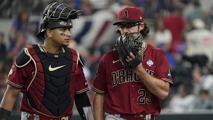 Oct 27, 2023; Arlington, TX, USA; Arizona Diamondbacks catcher Gabriel Moreno (14) and pitcher Zac Gallen (23) talk after the fourth inning in game one of the 2023 World Series against the Texas Rangers at Globe Life Field. Mandatory Credit: Raymond Carlin III-USA TODAY Sports