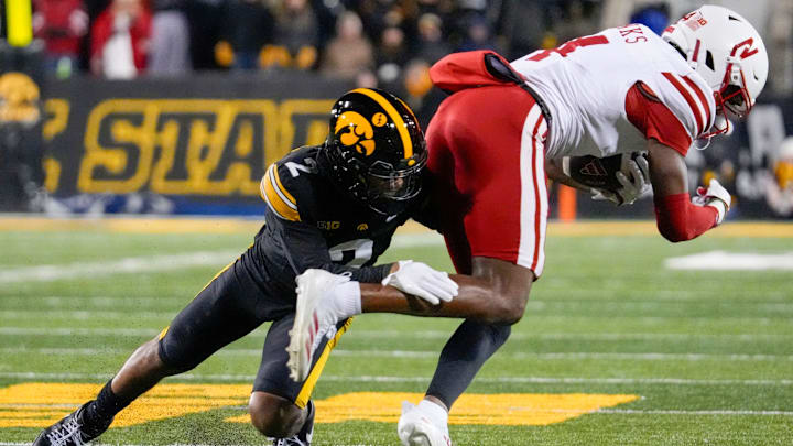 Iowa Hawkeyes defensive back TJ Hall (2) tackles Nebraska Cornhuskers wide receiver Jahmal Banks (4) Friday, Nov. 29, 2024 at Kinnick Stadium in Iowa City, Iowa.