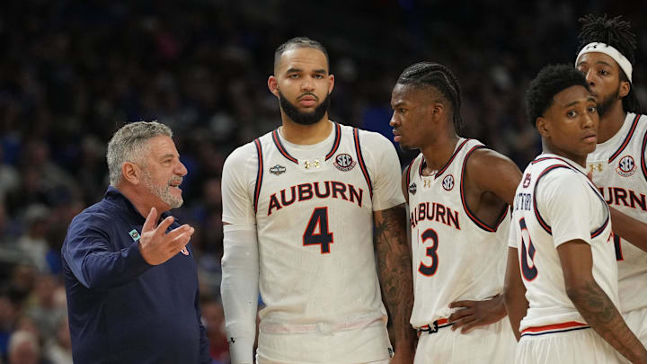 Apr 5, 2025; San Antonio, TX, USA; Auburn Tigers head coach Bruce Pearl talks with his players against the Florida Gators in the semifinals of the men's Final Four of the 2025 NCAA Tournament at the Alamodome. Mandatory Credit: Robert Deutsch-Imagn Images
