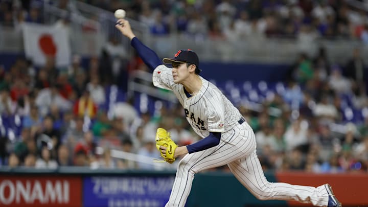 Mar 20, 2023; Miami, Florida, USA; Japan starting pitcher Roki Sasaki (14) delivers a pitch during the first inning against Mexico at LoanDepot Park. Mar 20, 2023; Miami, Florida, USA; Japan starting pitcher Roki Sasaki (14) delivers a pitch during the first inning against Mexico at LoanDepot Park.