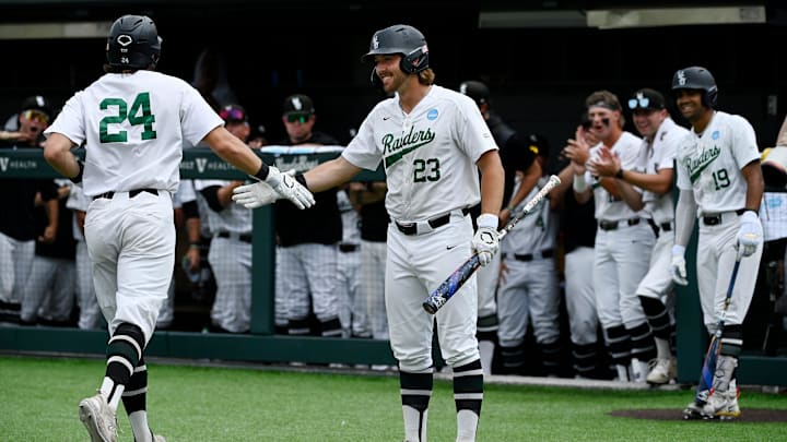 Wright State's Luke Arnold (24) is congratulated by Wright State's Cam Gilkerson (23) after hitting a solo home run during the first inning of the Nashville Regional NCAA Baseball Tournament elimination game at Hawkins Field Sunday, June 1, 2025, in Nashville, Tenn. Wright State's Luke Arnold (24) is congratulated by Wright State's Cam Gilkerson (23) after hitting a solo home run during the first inning of the Nashville Regional NCAA Baseball Tournament elimination game at Hawkins Field Sunday, June 1, 2025, in Nashville, Tenn.