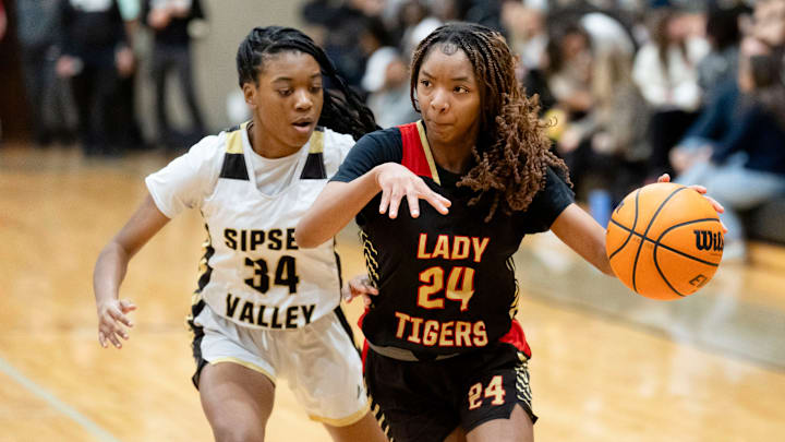 Greene County's Kassidi Smith (24) drives the ball against Sipsey Valley's Alyssia Simmons (34) at Sipsey Valley High School.
