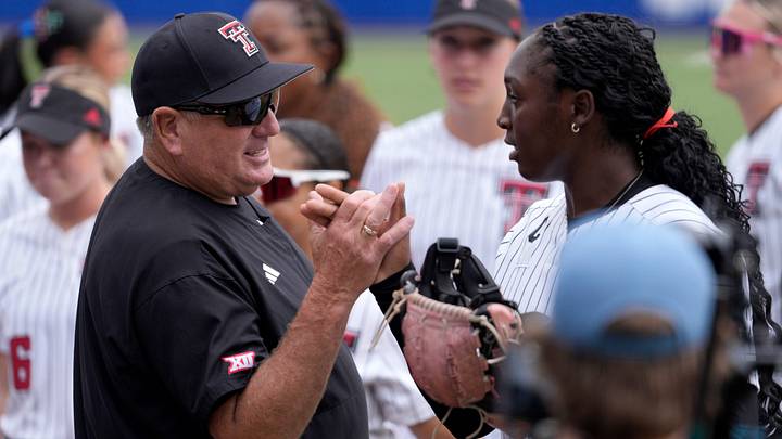 Texas Tech Red Raiders head coach Gerry Glasco talks with Texas Tech Red Raiders pitcher Nijaree Canady (24) during a Women's College World Series softball game between the Texas Tech Red Raiders and the Mississippi State Bulldogs at Devon Park in Oklahoma City, Thursday, May 28, 2026. Texas Tech Red Raiders head coach Gerry Glasco talks with Texas Tech Red Raiders pitcher Nijaree Canady (24) during a Women's College World Series softball game between the Texas Tech Red Raiders and the Mississippi State Bulldogs at Devon Park in Oklahoma City, Thursday, May 28, 2026.