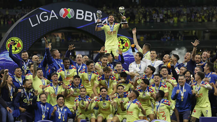 Henry Martín #21, of Club America lifts the Liga MX...