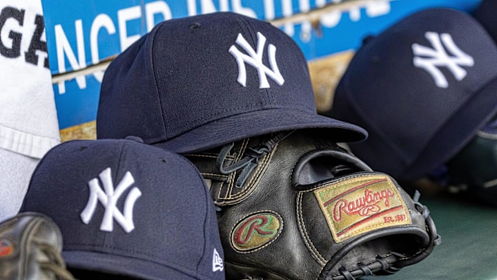 Apr 7, 2025; Detroit, Michigan, USA; New York Yankees baseball hats and gloves in the dugout out in the eighth inning against the Detroit Tigers at Comerica Park. Mandatory Credit: David Reginek-Imagn Images Apr 7, 2025; Detroit, Michigan, USA; New York Yankees baseball hats and gloves in the dugout out in the eighth inning against the Detroit Tigers at Comerica Park. Mandatory Credit: David Reginek-Imagn Images
