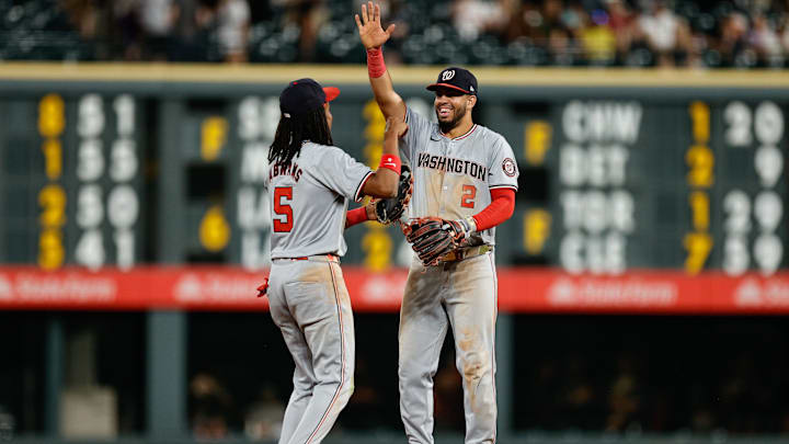 Jun 21, 2024; Denver, Colorado, USA; Washington Nationals shortstop CJ Abrams (5) and second baseman Luis Garcia Jr. (2) celebrate after the game against the Colorado Rockies at Coors Field. 