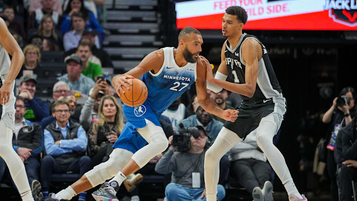 Feb 27, 2024; Minneapolis, Minnesota, USA; Minnesota Timberwolves center Rudy Gobert (27) dribbles